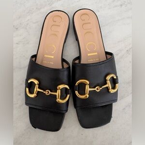 Gucci Women's Black Slide Sandal with Gold Accents